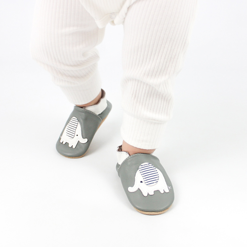 Toddler walking while wearing Dotty Fish Nya the Elephant soft sole baby shoes