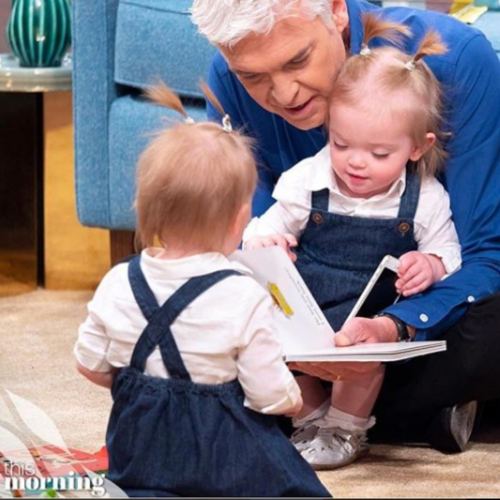 Triplets wearing Dotty Fish Silver T-bar shoes while reading stories with Philip Schofield