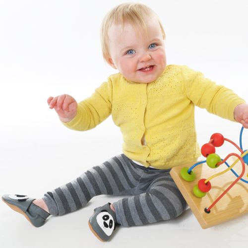 Baby playing while wearing Dotty Fish Pitter Patter Panda soft leather baby shoes with non-slip soles