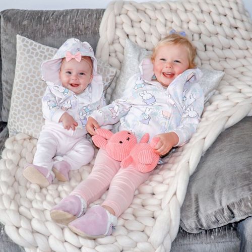 Young children wearing pink suede slippers by Dotty Fish 