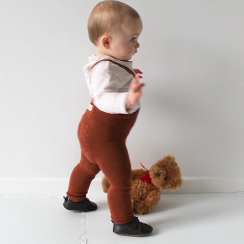 Baby boy taking fist steps wearing brown leather Oliver toddler shoes by Dotty Fish 
