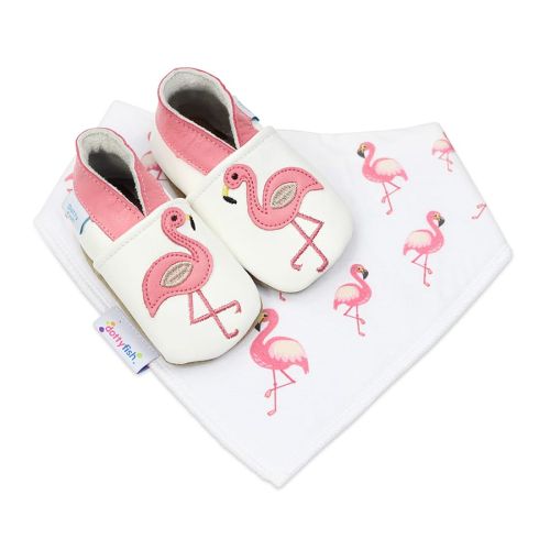 White leather baby shoes with pink flamingo motif and matching cotton baby bib with pink flamingo design