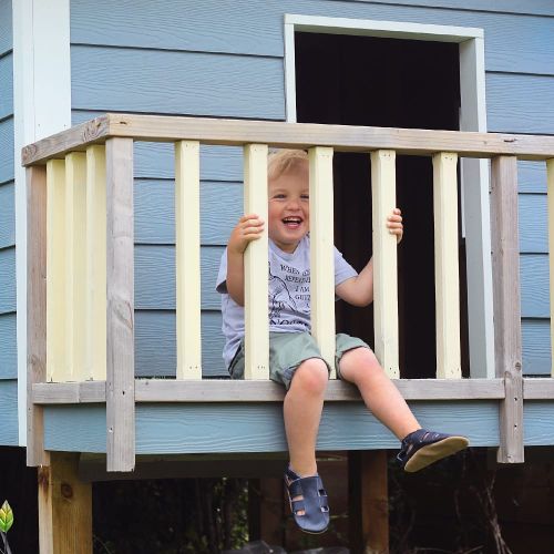 Little boy playing while wearing navy blue sandals from Dotty Fish 