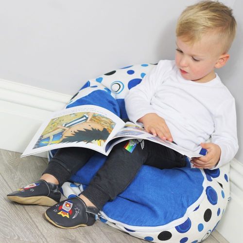 Toddler reading a book while wearing Dotty Fish Blast Off space rocket leather slippers