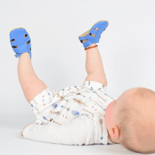 Baby wearing bright blue soft leather sandals from Dotty Fish 