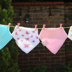 Washing line with cotton bandana bib with pink butterfly design from Dotty Fish 