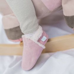 Toddler wearing pink suede slippers by Dotty Fish 