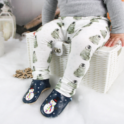 Toddler wearing snowman motif soft leather slippers by Dotty Fish at Christmas