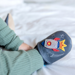 Baby wearing Dotty Fish Blast Off leather baby shoes with space rocket design