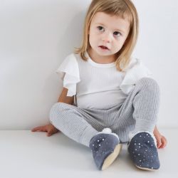 Little girl wearing cosy grey suede slippers with silver stars from Dotty Fish 
