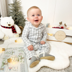 Baby wearing Dotty Fish slippers on Christmas - ideal gift